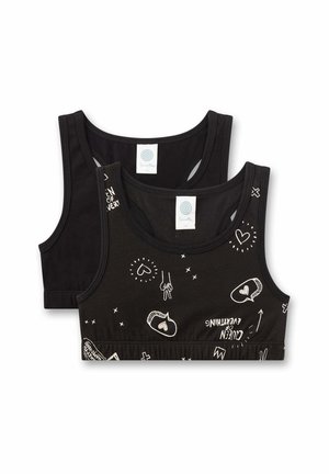 Due reggiseni sportivi neri, uno semplice e uno con stampe di schizzi bianchi a forma di cuore e scritte, mostrati piegati in piano con etichette del marchio visibili all'interno degli scolli.