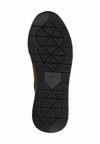 Semelle de chaussure en caoutchouc noir avec un motif de semelle texturé comportant des formes géométriques et une empreinte de logo, conçue pour une adhérence et une durabilité optimales.