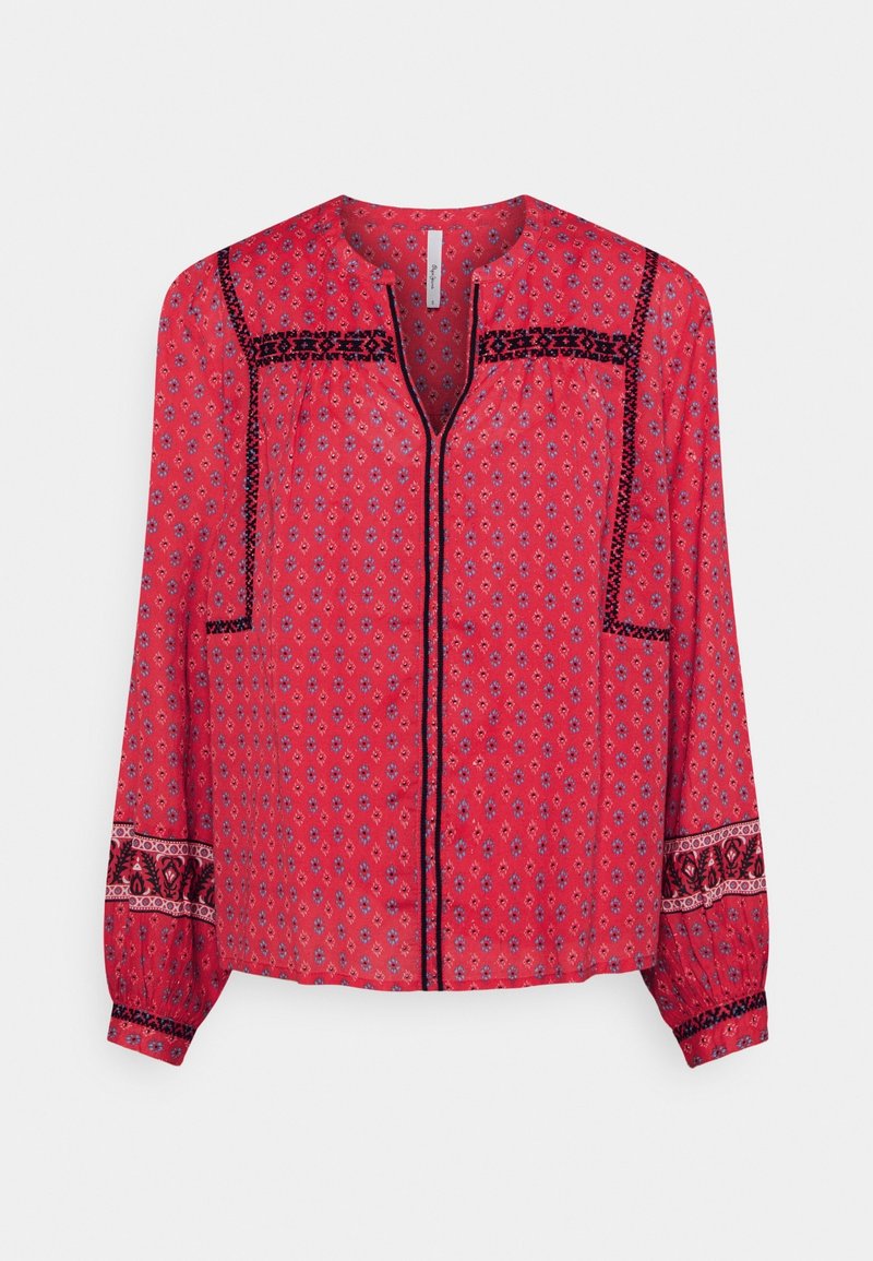 Czerwona bluzka z długim rękawem w mały kwiatowy wzór, z czarnym geometrycznym wykończeniem na piersi, rękawach i przednim rozcięciu oraz z okrągłym dekoltem.