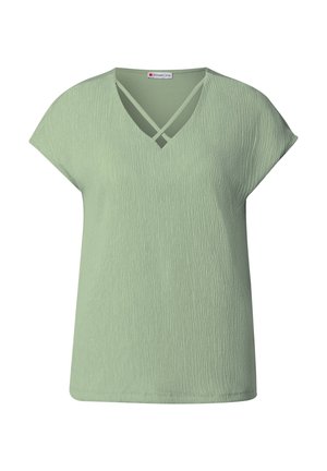 T-shirt vert clair à col en V avec des manches courtes ; tissu texturé et détails croisés au niveau du col ; coupe ample et finition lisse.