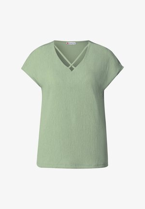 Hellgrünes V-Ausschnitt-T-Shirt mit kurzen Ärmeln; strukturierter Stoff und gekreuzte Details am Ausschnitt; lockere Passform und glatte Oberfläche.