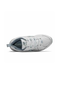 Sports shoe in white and light blue. Features a textured synthetic upper, padded collar, and laces. The logo is prominent on the side.