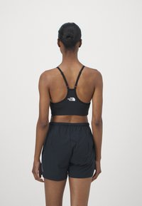 The North Face FLEX BRA - Športni modrček s srednjo podporo - black