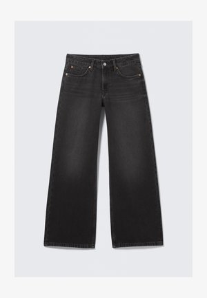 Mustad laia säärega teksad, millel esiküljel nööp ja lukk, vööaasad ning klassikaline viie taskuga disain, näidatud lahtiselt heledal taustal.