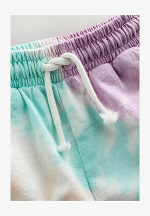 Pantalones de chándal con un patrón de tie-dye que presenta suaves tonos pastel de azul verdoso, lavanda y blanco. Incluye un cordón blanco en la cintura.