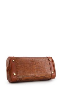 Brown crocodile-embossed leather bag with a rectangular shape, brass hardware accents, and a smooth texture. Closed at one end, open at the other.