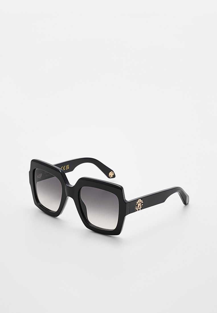 Black square sunglasses with gradient lenses. Features golden hardware detailing on the side. Made of smooth plastic material.