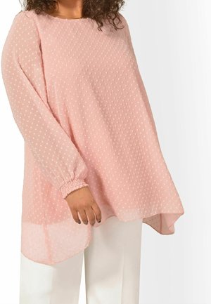 Helle rosa, durchsichtige Bluse mit dezenten, strukturierten Punkten. Lange Ärmel mit elastischen Bündchen. Mit abgerundetem Saum und lockerer Passform, die gut zu weißen Hosen passt.