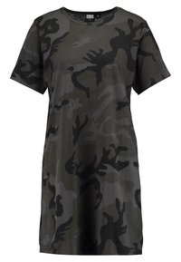Camo T-shirt dress in shades of dark green and black. Short sleeves, round neck, and soft fabric with a smooth texture. Loose-fit design.