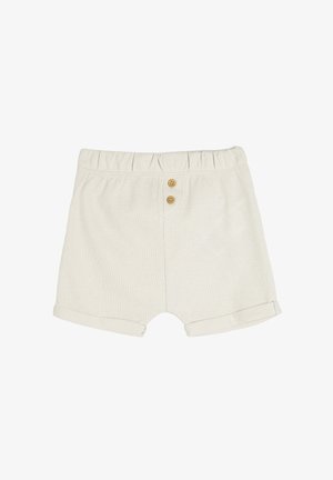 Pantalones cortos de textura de gofre, color crema, con cintura elástica, que cuentan con dos botones de madera y dobladillos enrollados.