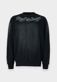 Black sweatshirt with long sleeves, round neckline, and elastic cuffs. Features "Eternal Redemption" embroidered in script on the chest.