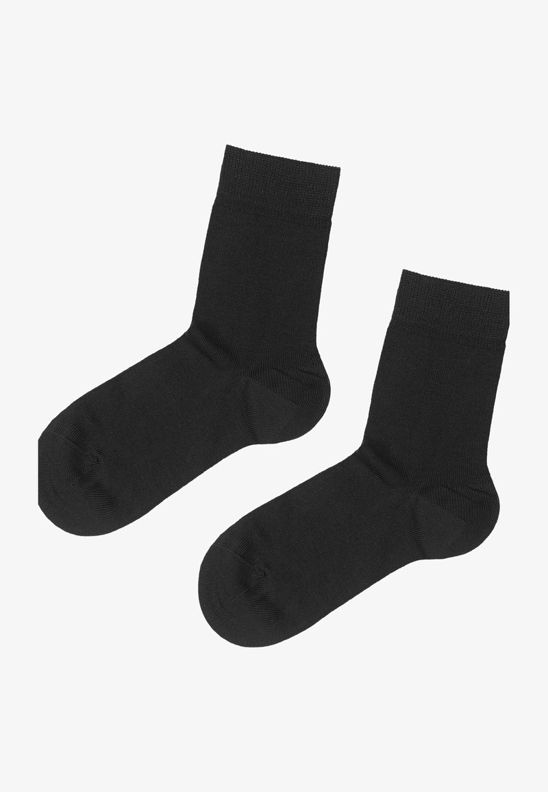 Calze alla caviglia nere, realizzate in un tessuto morbido, con un polsino a coste, una texture liscia e un design della punta standard, con un aspetto senza cuciture.