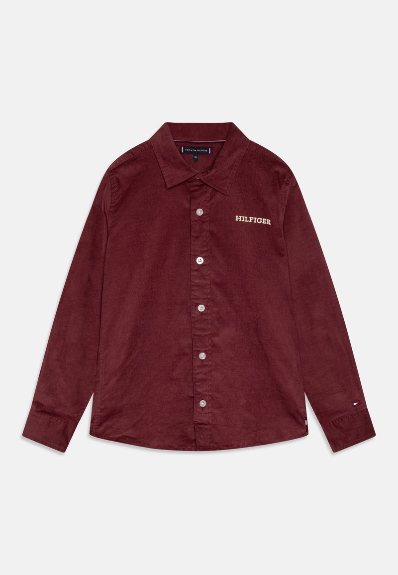 Chemise en velours côtelé bordeaux à manches longues avec boutons sur le devant, col, "Hilfiger" brodé sur la poitrine et petit logo sur le poignet.