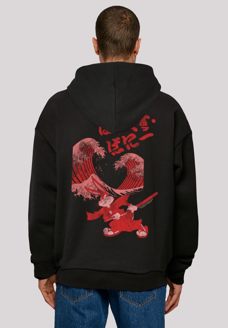 Black hoodie featuring a bold red graphic of a character with waves and a sword. Made of soft cotton blend, showcasing a relaxed fit.