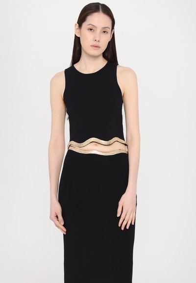 Black sleeveless dress featuring a wavy gold belt at the waist, smooth fabric with a fitted silhouette, and a knee-length design.