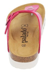 Rosa flip-flop sandal med korkfotbett, vit sula och glansig rem. Texturerad innersula med "Palado"-märke.