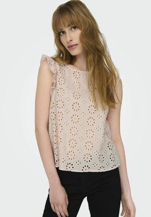 Top senza maniche rosa chiaro con design in occhio di pernice floreale, dettagli di spalle arricciate e una vestibilità rilassata. Realizzato in tessuto traspirante, offre una texture.