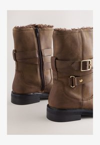 Unselected, chestnut brown oiled leather