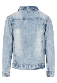 Vaaleansininen farkkutakki, jossa on klassinen kaulus, napitettavat hihat ja hieman kulutettu pinta. Takana näkyy sauma- ja yksityiskohtia.