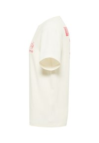 T-shirt en coton crème à manches courtes, avec un imprimé graphique rouge sur le devant et le dos. Col rond classique, ourlet droit.