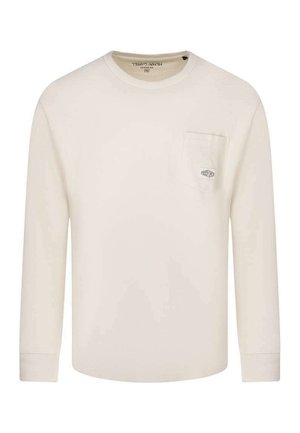 Chemise à manches longues couleur crème avec encolure ronde et poche poitrine ornée d'un petit patch logo rectangulaire.