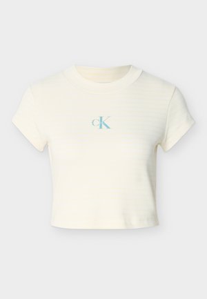 Lyhyt kerma t-paita, jossa on hienovaraiset keltaiset raidat, ribbineulos ja keskellä rintaa vaaleansininen logo. Lyhyet hihat ja pyöreä kaula-aukko.