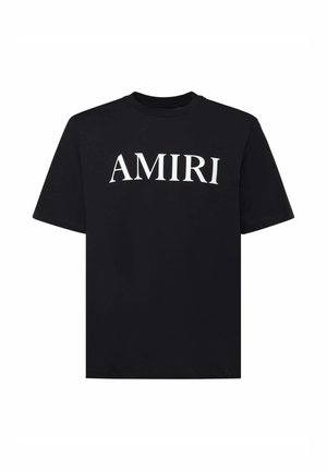 T-shirt nera a maniche corte con scollo rotondo e grande logo "AMIRI" bianco centrato sul petto.