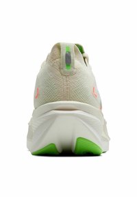 Sport shoe with a textured cream upper, featuring neon accents in orange and green. Cushioned sole with a distinctive heel shape.