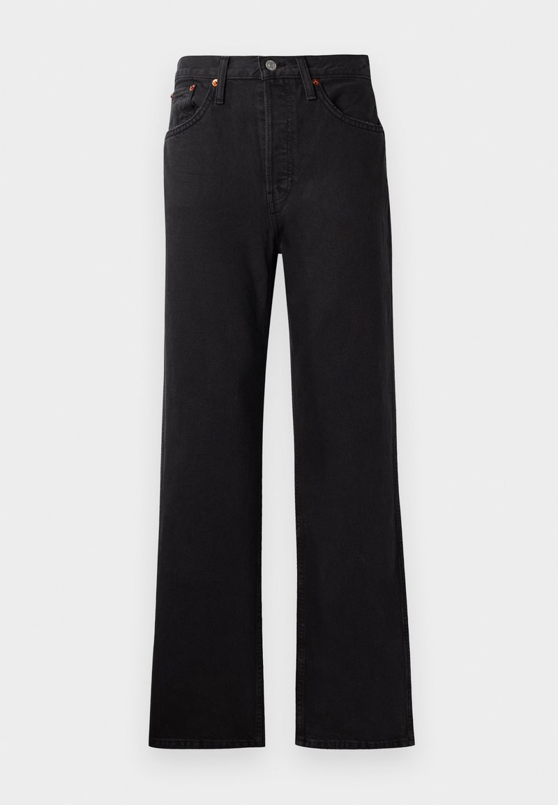 Jean en denim noir taille haute avec une jambe évasée, présentant des coutures visibles, un design à cinq poches et des accents en métal cuivré.