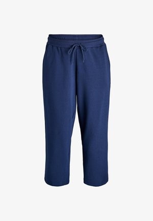 Tamsiai mėlynos capri tipo sportinės kelnės su elastingu juosmeniu, reguliuojamu raišteliu ir šoninėmis kišenėmis. Minkšta medžiaga su glotnia tekstūra.