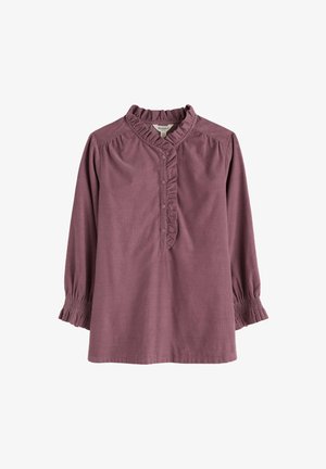 Aviečių spalvos bluzelė su raukinėta iškirpte, mygtukų užsegimu ir sus gathered trijų ketvirčių rankovėmis. Pagaminta iš minkštos, tekstūruotos medžiagos.