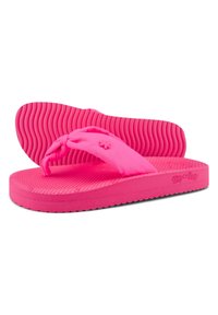Pink flip-flops with a textured rubber sole and soft fabric straps; rounded toe post and logo detail on the side.