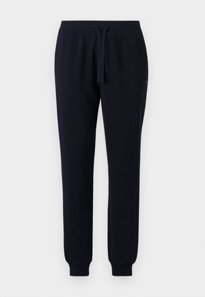 Pantalon de jogging bleu marine avec taille élastique, cordon de serrage ajustable, poignets côtelés et poches latérales, présenté sur fond uni.