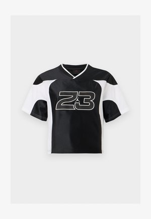 Mustvalge lühikeste varrukatega spordisärk, millel on ees keskel number „23“ ja Jumpmani logo, ning varrukatel võrkvalged paneelid.