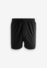 Shorts de boxe noirs en tissu lisse. Dotés d'une taille élastique et d'une fermeture à un bouton avec une petite poche à l'avant.