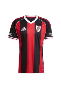 Camiseta de fútbol de rayas verticales rojas y negras con cuello en V, detalles blancos, mangas cortas y un logo del equipo en el lado izquierdo del pecho.
