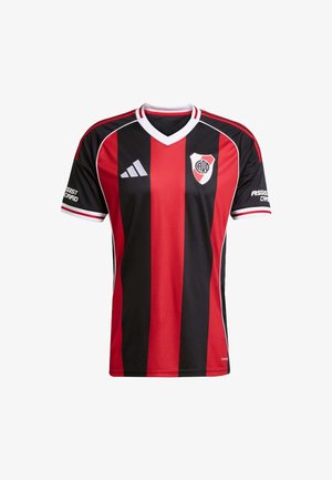 Maglietta da calcio a strisce verticali rosse e nere con collo a V, dettagli bianchi, maniche corte e logo della squadra sul lato sinistro del petto.