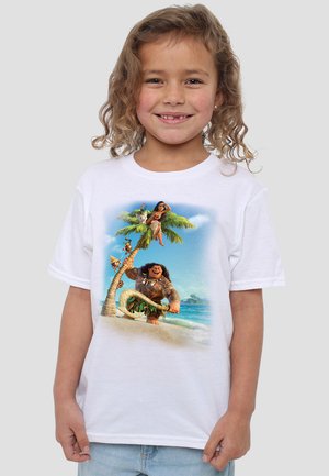 White t-shirt featuring a colorful graphic of two animated characters by a palm tree on a beach backdrop, with ocean and sky details.