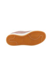 Shoe sole with a textured orange rubber, featuring a herringbone pattern, surrounded by a white edge. Overall, a smooth and streamlined design.