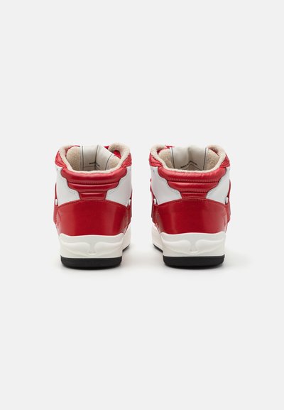 High-top sneakers featuring a glossy red and white leather upper. Textured interior, padded collar, and black rubber outsole.
