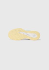 Lightweight athletic shoe outsole in yellow rubber, featuring a textured pattern for grip and a white midsole with integrated vents.