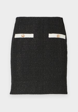 Black tweed skirt with textured fabric and a fitted design. Features two white pocket accents with gold-tone buttons.