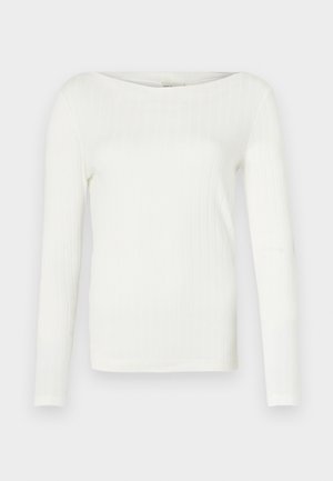 White long-sleeve ribbed top with a wide boat neckline, featuring a fitted silhouette and soft fabric texture. No notable accents or patterns.