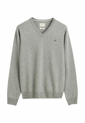 Gray v-neck sweater in soft fabric, featuring ribbed cuffs and hem, with a small, intricate logo embroidered on the chest.