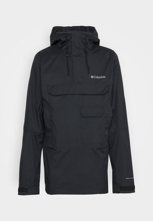 Veste imperméable noire Columbia à capuche avec poche frontale à rabat, cordons de serrage réglables et sangles de poignet en Velcro.