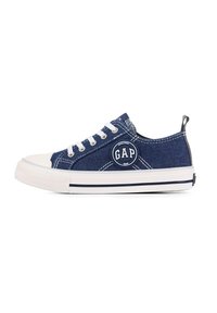 Blue denim sneaker with white rubber toe cap and outsole. Features logo patch, white laces, and contrasting stitching details.