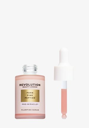 Botella de suero rellenador Revolution Beauty London PDRN Pink Peptide Pro-Miracle con cuentagotas que contiene líquido rosa claro.