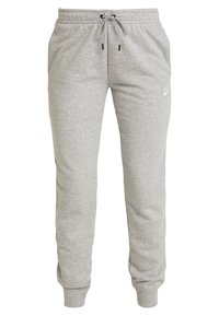 Grå sweatpants i en bomullsblandning. Har en elastisk midja med dragsnodd, muddade ankelavslutningar och en liten logotyp på sidan.