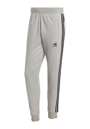Grå mjukisbyxor i en bomullsblandning. Har svarta sidostickningar och en broderad svart logotyp på vänstra låret. Elastisk midja.
