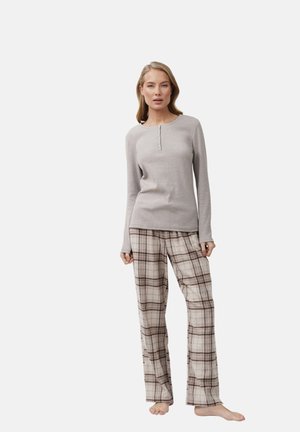Gray long-sleeve top with button detailing paired with beige plaid pants. Soft fabric texture, loose fit, and neutral color scheme.